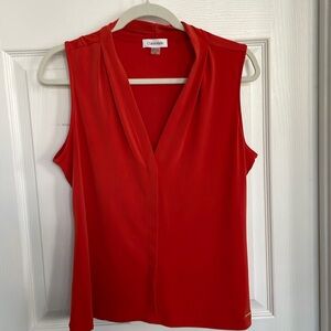 Calvin Klein sleeveless blouse.  Coral/orange colored